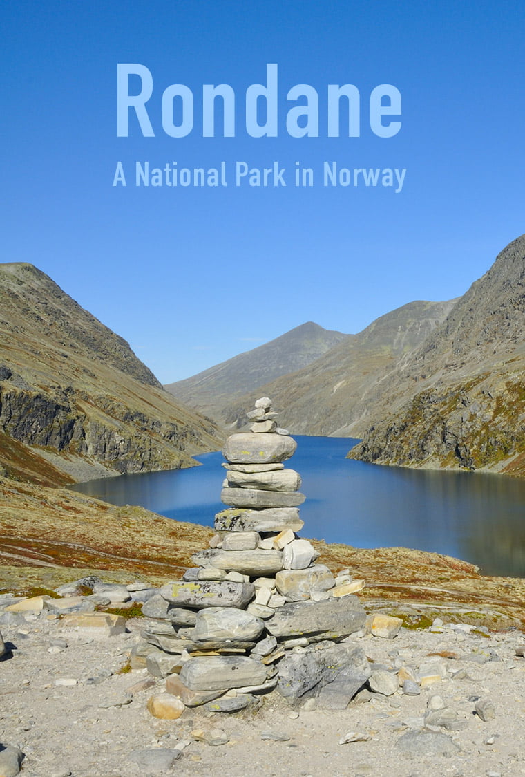 Cairn in front of a lake in Rondane National Park in central Norway