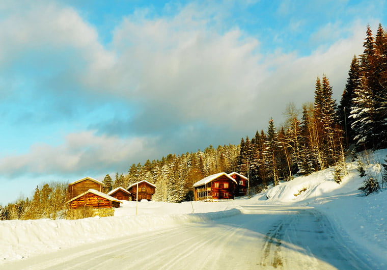 Snowy mountain farm scene in Norway