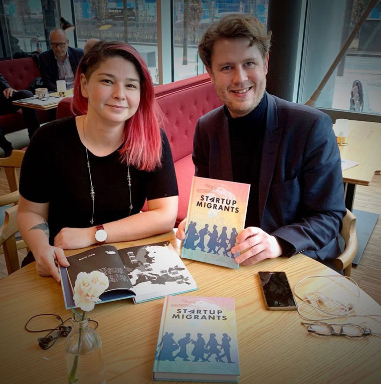 Startup Migrants books in a cafe