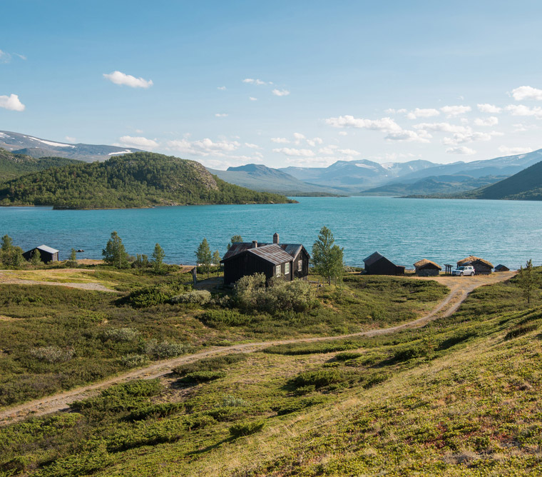 Wooden cabin by Gjende lake in Norway