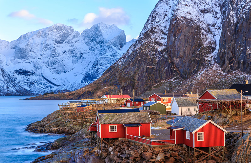 Red fishing cottages in Reine, a Norway vacation hotspot