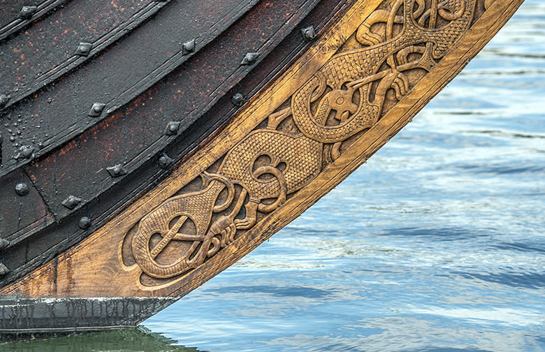 Close-up of carvings on a Viking ship