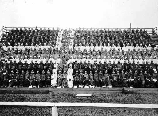 Chorus of singers forming the Norwegian Flag for the Norwegian Centennial Celebration at the Minnesota State Fair Grounds, June 1925.