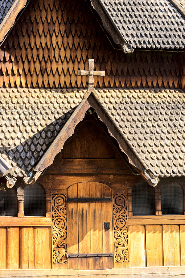 A close-up of the exterior of Heddal wooden church in rural Norway