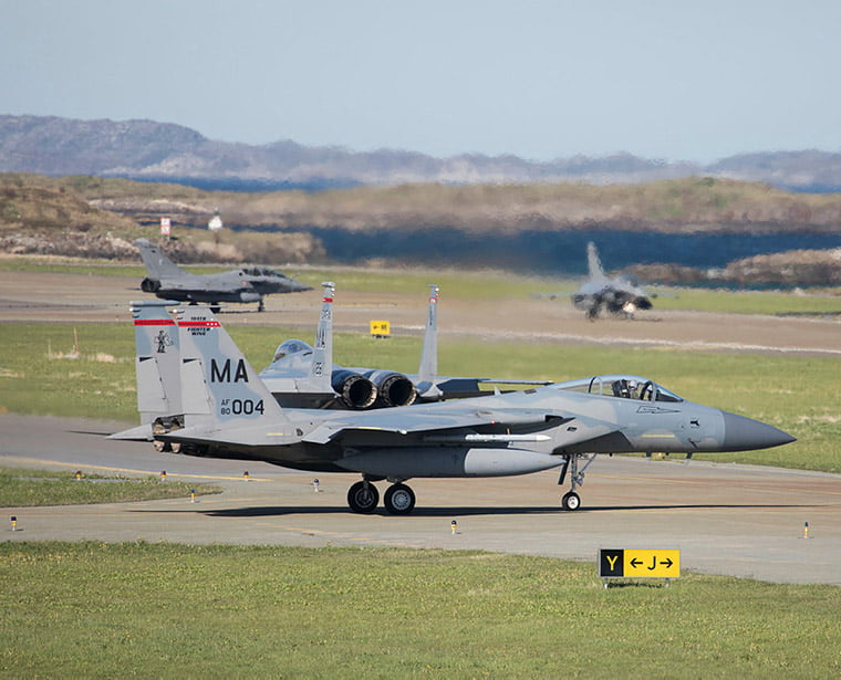 Two american F-15 getting ready for take off with two french rafale in the background during the exercise Arctic Challenge Exercise 2019 at Bodø Air Station.