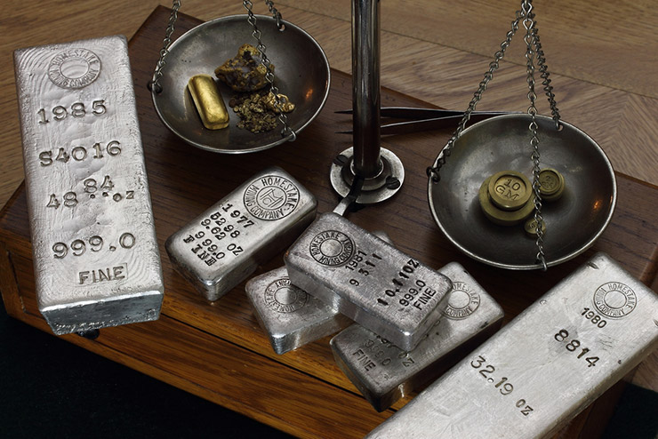 Silver and gold being weighed on scales