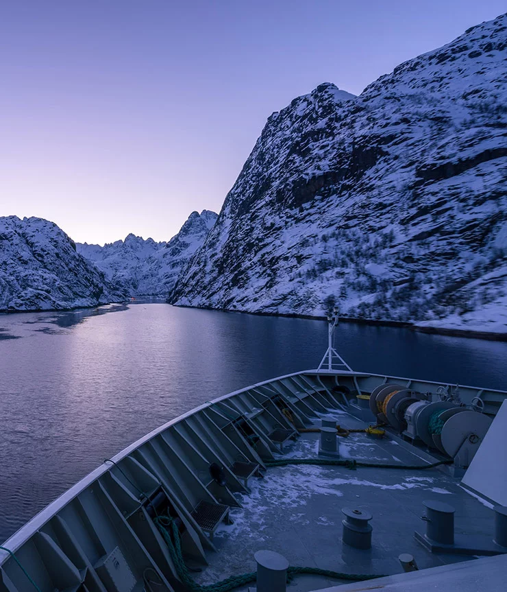Entrance to Norway's Trollfjord in purple light