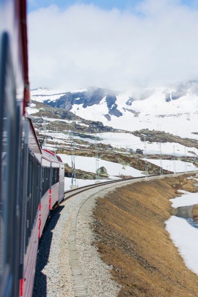 View of snowy mountains from the Oslo to Bergen railway