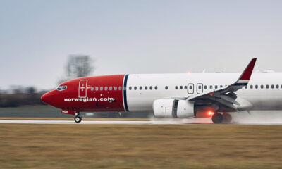 Norwegian Air plane taking off in the rain