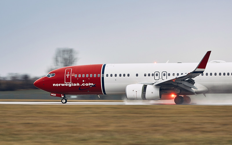 Norwegian Air plane taking off in the rain