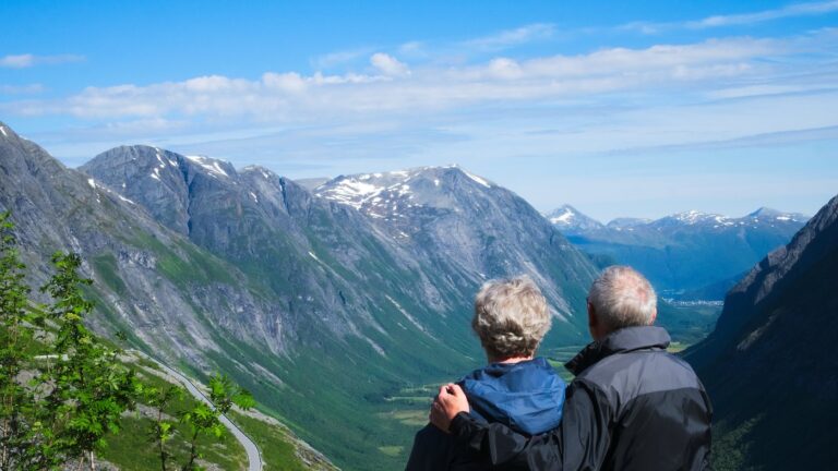 Retired couple at a Norway viewpoint.