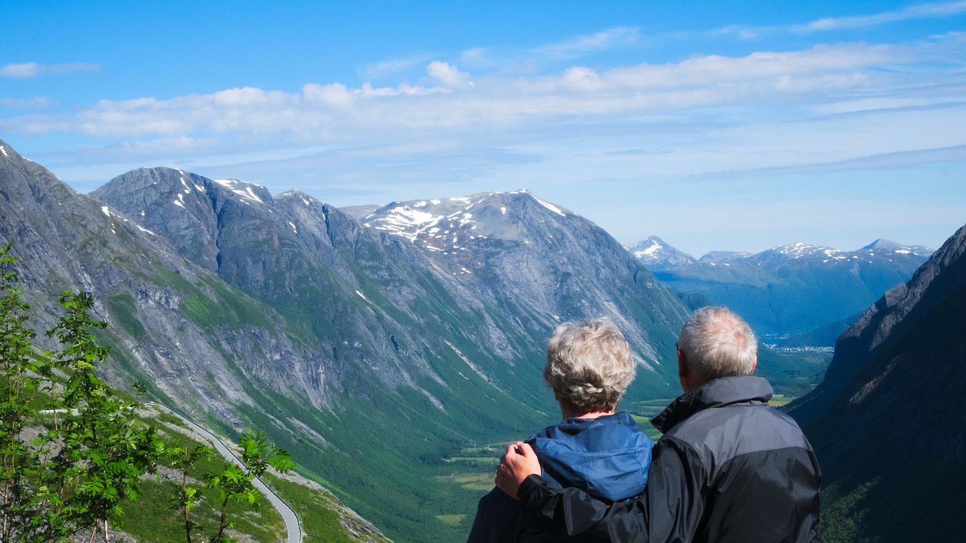 Retired couple at a Norway viewpoint.
