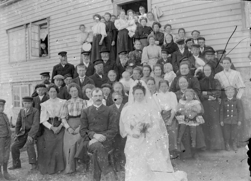 A historic wedding party outside a house in Fjord Norway