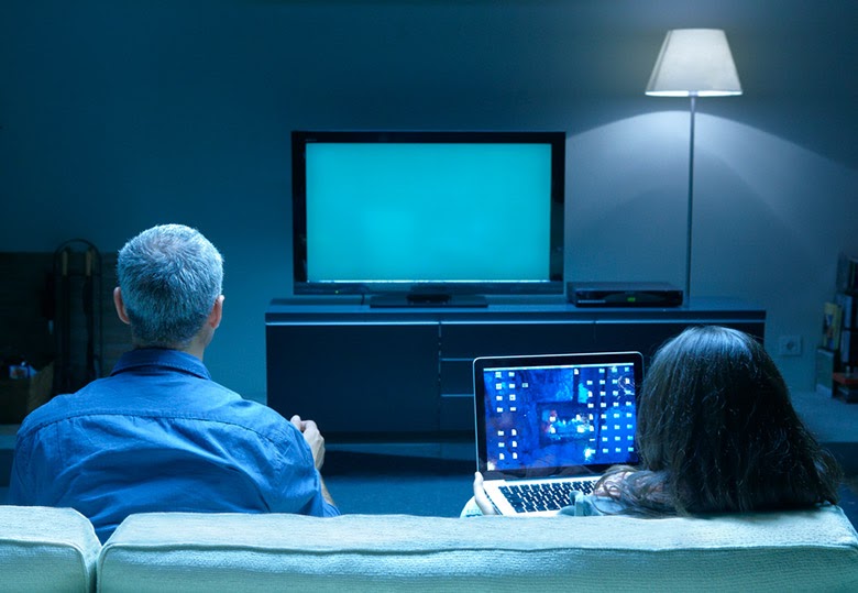 Family watching TV together