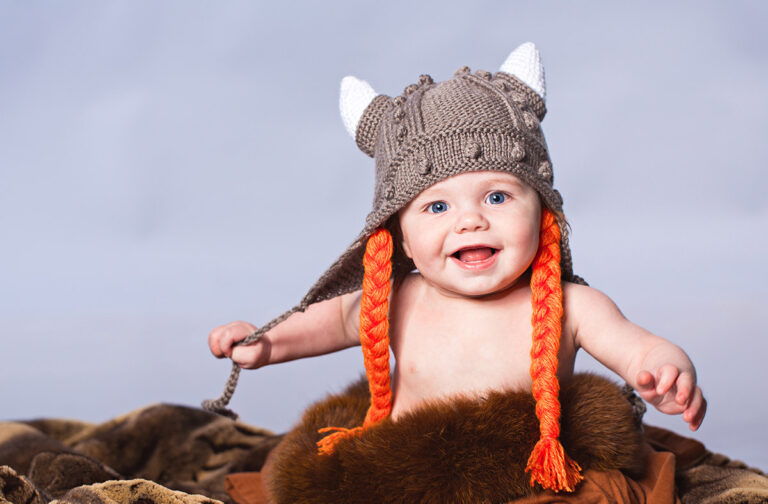 Norwegian baby dressed up as a Viking.