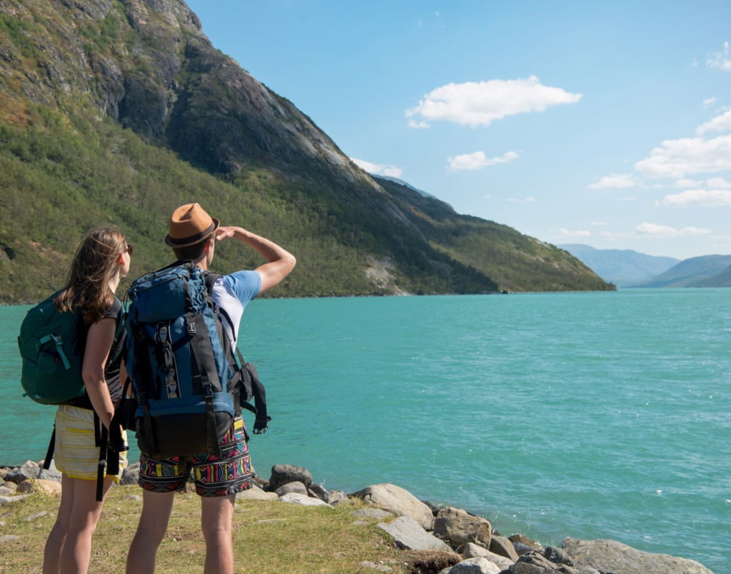 Hikers looking out over the water in Norway