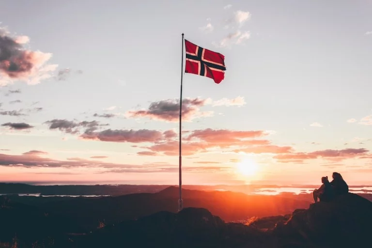 A Norwegian flag flying high above Oslo, Norway