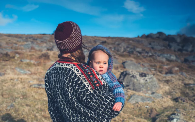 Norwegian baby and parent out in the nature of Norway.