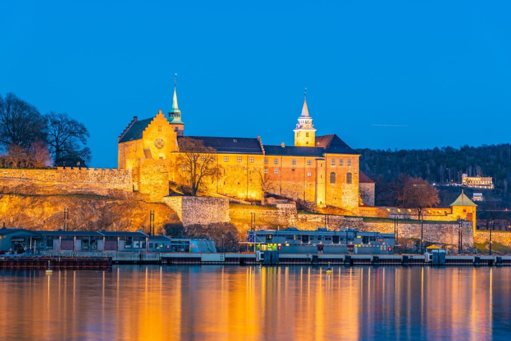 A floodlit view of Oslo's Akershus Castle in Norway