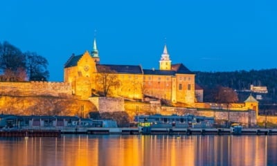 A floodlit view of Oslo's Akershus Castle in Norway