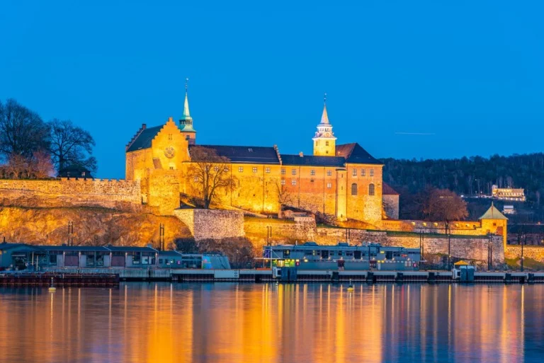 A floodlit view of Oslo's Akershus Castle in Norway