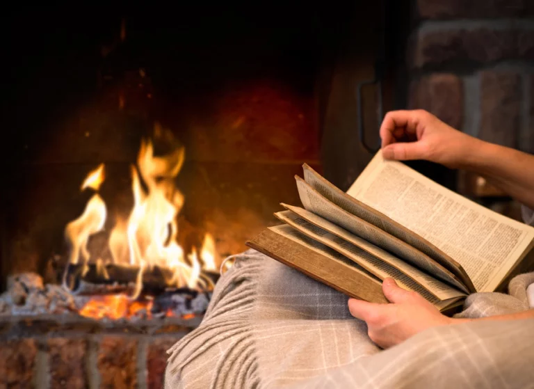 Reading a Norwegian crime novel by a cosy fireplace