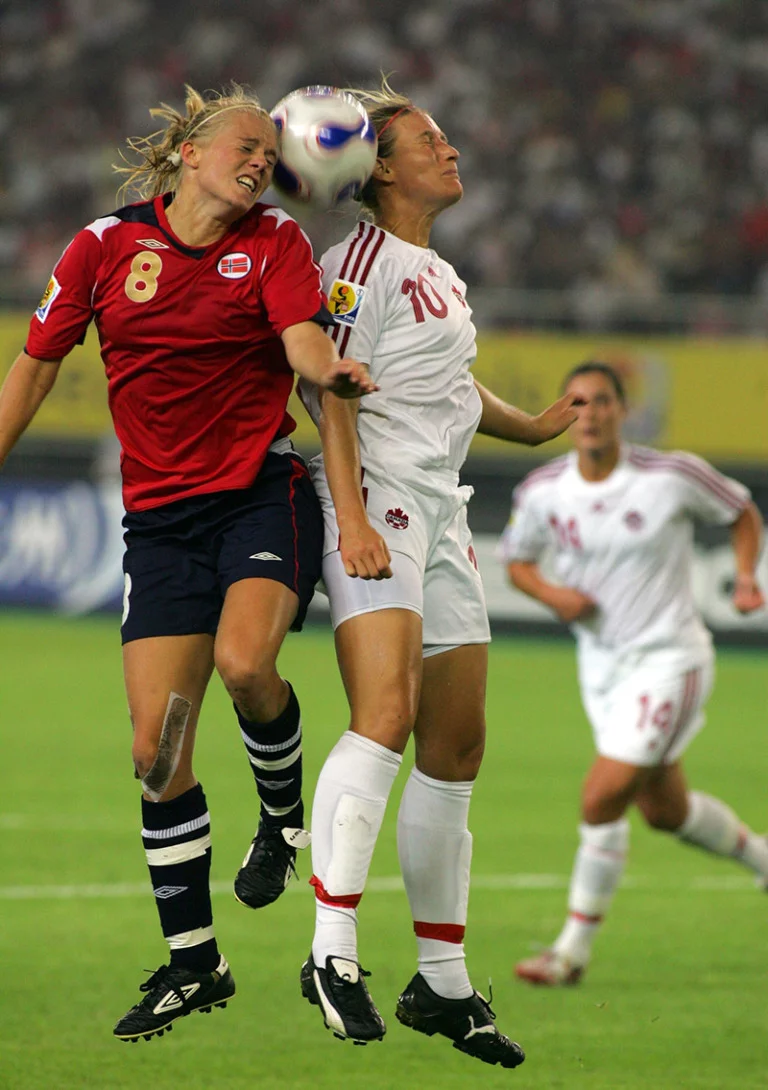 Solveig Gulbrandsen of Norway, left, competes with Martina Franko of Canada during a Group C match of the 2007 FIFA Womens World Cup in Hangzhou, east Chinas Zhejiang province 12 September 2007. Norway defeated Canada 2-1.
