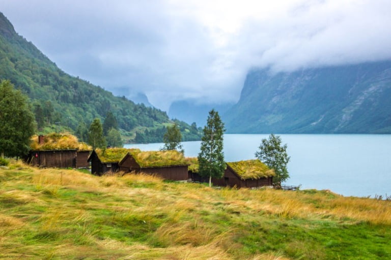 Historic farm buildings by the lakeside in Loen, Norway