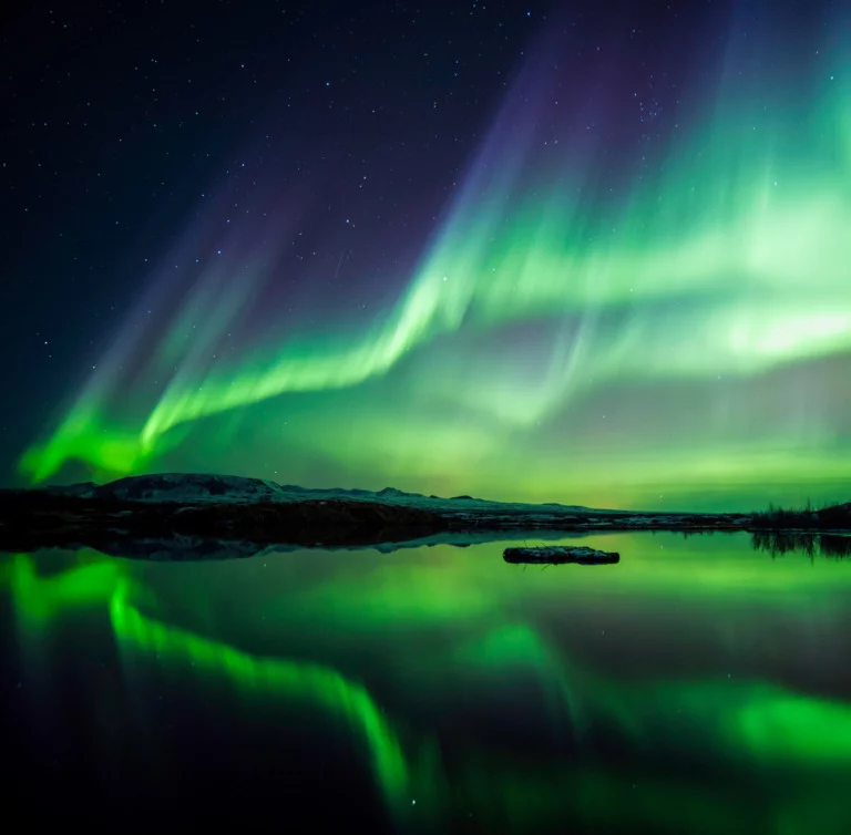 Green aurora reflected in a Scandinavian lake.