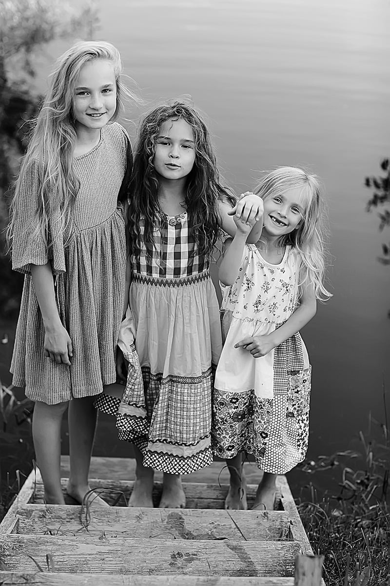 Norwegian girls by a fjordside.