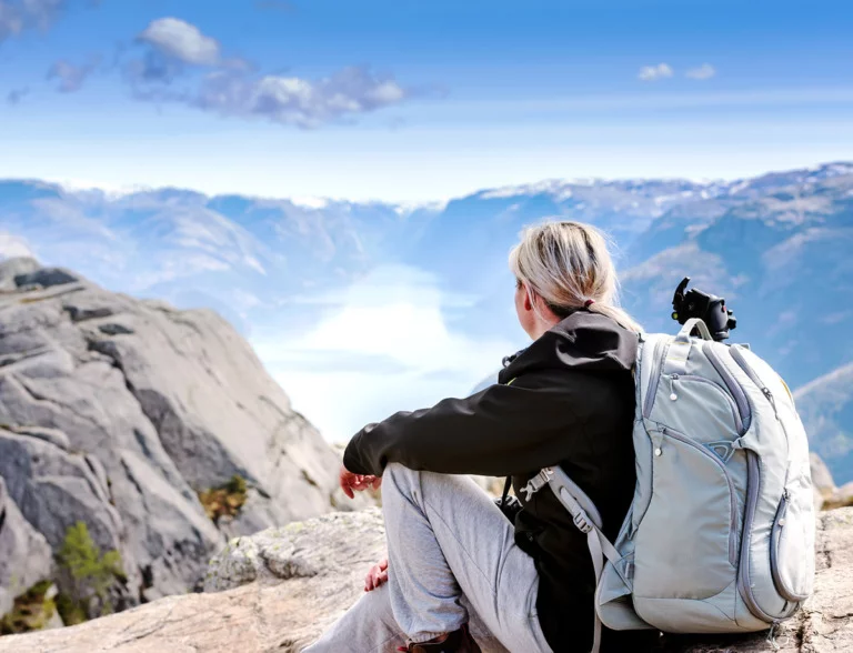 A Norwegian woman hiking above the Lysefjord in southwest Norway.