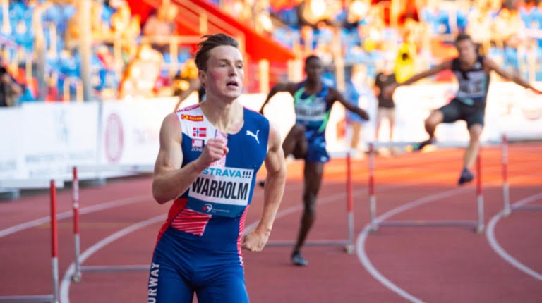 Norwegian athlete Karsten Warholm in a hurdles race