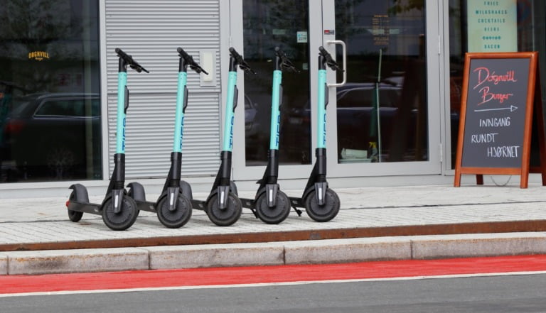 Electric scooter rental on a sidewalk in Oslo, Norway