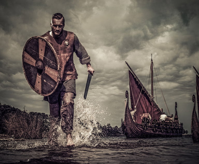 A Viking warrior rushing to shore