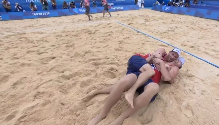 Anders Mol and Christian Sørum celebrate on the sand