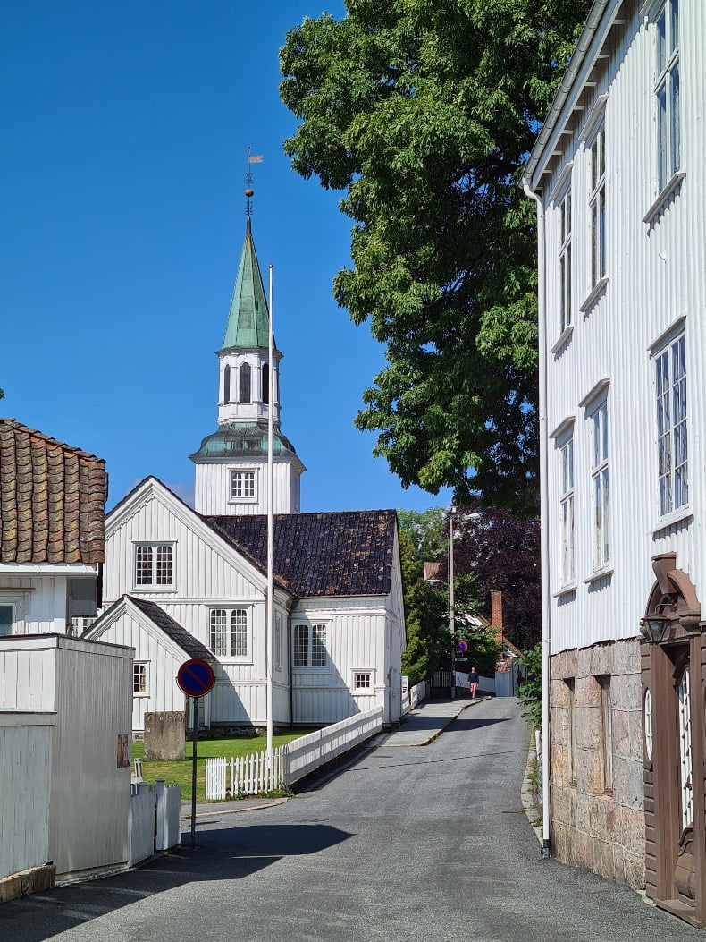 A charming street of white, wooden buildings in Risør