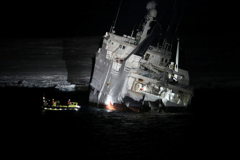 Norwegian Coast Guard supporting Northguider after the vessel crashed on Svalbard.