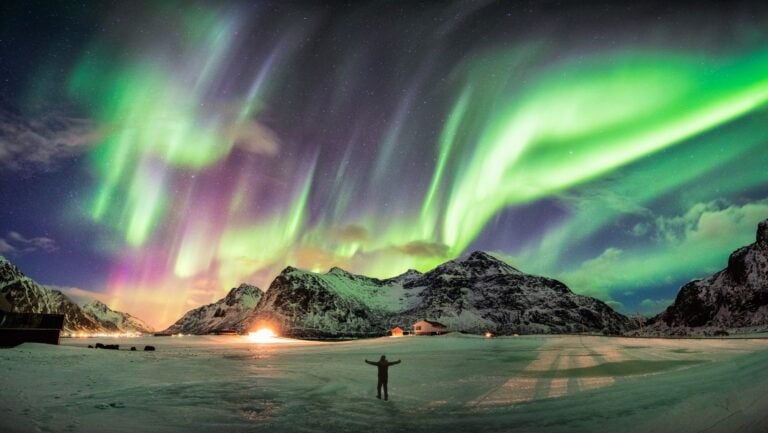 The northern lights fill the night sky.