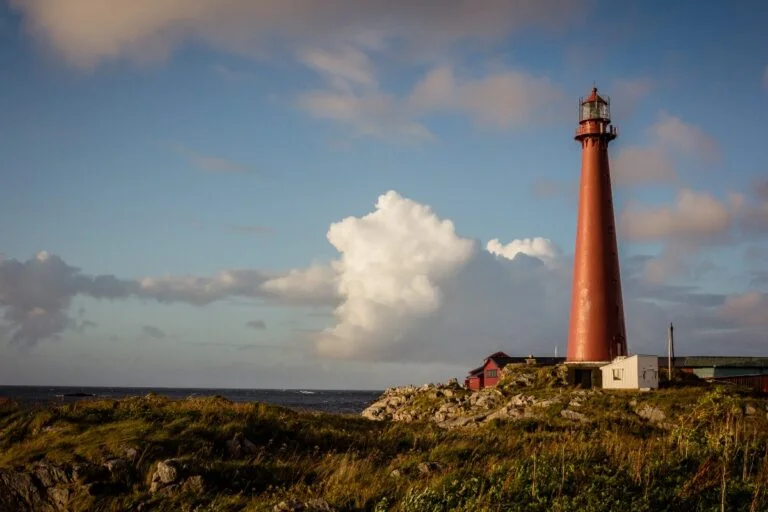 The dark red Andenes lighthouse