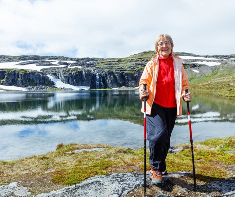 Pensioner hiking in rural Norway