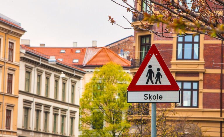 A Norwegian school sign in Oslo. Photo: oliverdelahaye / Shutterstock.com.