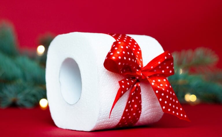 Toilet roll with red ribbon.
