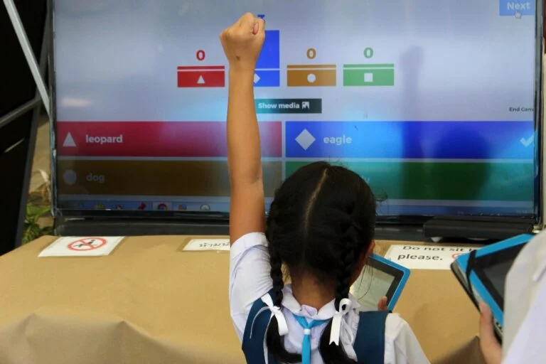 Children playing a Kahoot quiz.