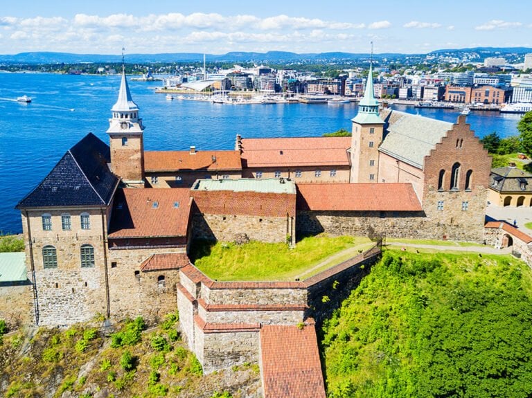 Oslo's Akershus Castle with Aker Brygge in the background.