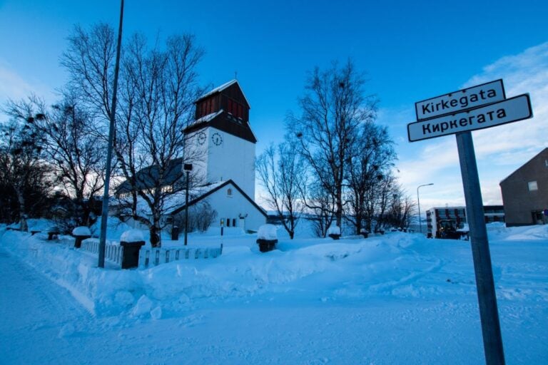 Kirkenes church with Norwegian & Russian language street sign.