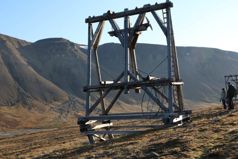 A cable way prop (taubanebukk) on a deformed timber foundation, which is affected by soil movements on a permafrost slope, the valley of Endalen, surroundings of Longyearbyen, Svalbard. Photo: Anatoly Sinitsyn.