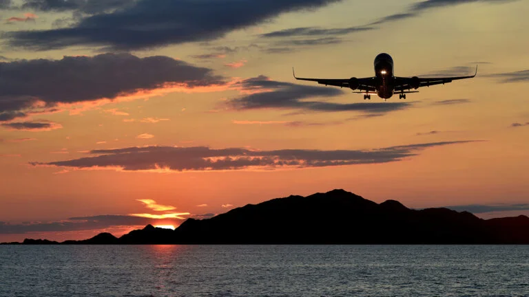 Aircraft landing in Norway at sunset