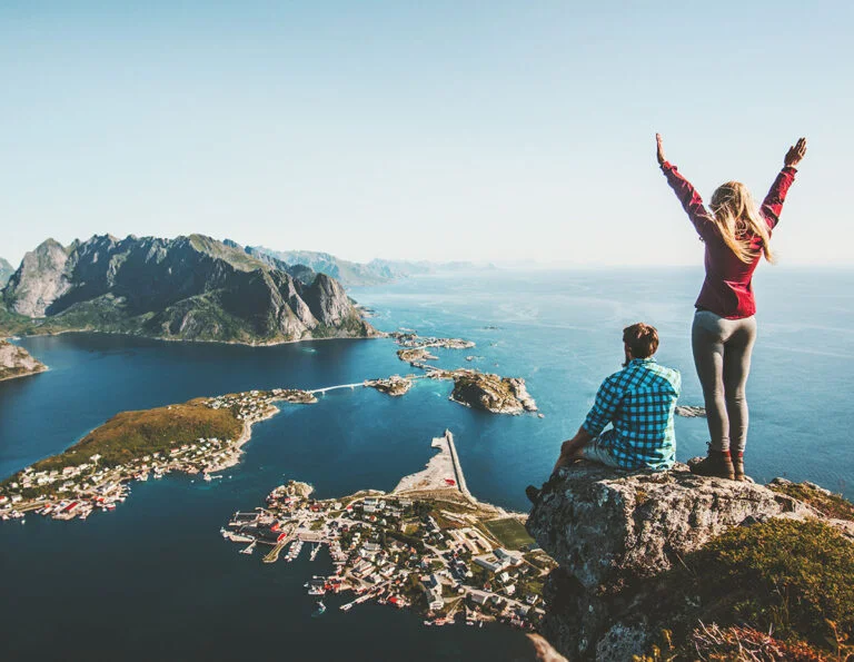 Hikers admiring the Lofoten Islands of Northern Norway