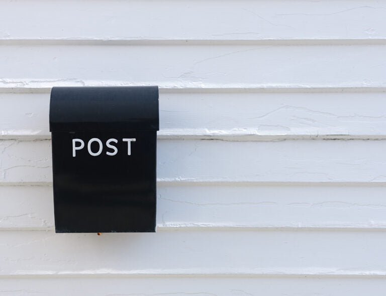 A white mailbox in Norway.