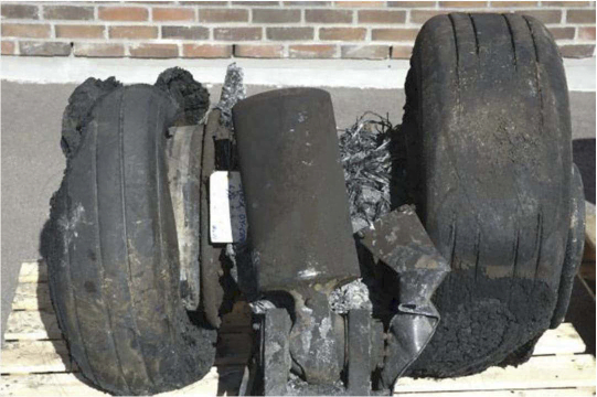 The main left landing gear after the accident.